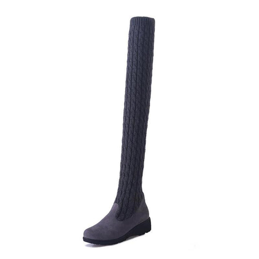 Mandotos high flat over-the-knee stretch Martin boots showcasing sleek black leather and knee-high design.