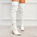 Black high heel elastic knee-length patent leather boots by MANDOTOS with sleek design and shiny finish.