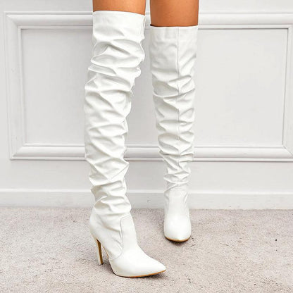 Black high heel elastic knee-length patent leather boots by MANDOTOS with sleek design and shiny finish.