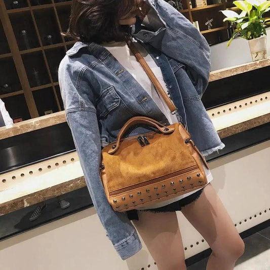 Large casual female shoulder tote bag by MANDOTOS, soft fabric with spacious interior and stylish design.