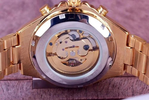 Mandotos hollow automatic mechanical watch with visible internal gears and sleek black strap, showcasing intricate craftsmanship.