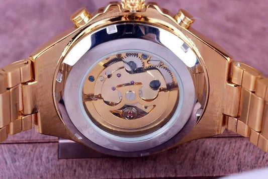 Mandotos hollow automatic mechanical watch with visible internal gears and sleek black strap, showcasing intricate craftsmanship.