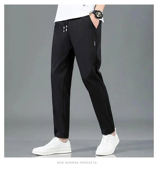 Mandotos Ice Silk men's summer casual pants in black and gray, featuring a straight-leg, elastic waistband, breathable and lightweight fabric.