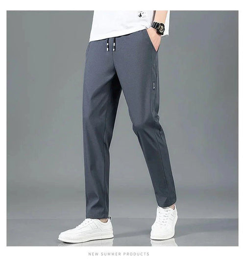 Mandotos Ice Silk men's summer casual pants in black and gray, breathable, elastic, straight-leg sweatpants for outdoor or business wear.
