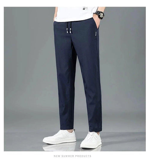 Mandotos Ice Silk men's summer black and gray casual pants with elastic waistband, breathable straight-leg design for outdoor wear.