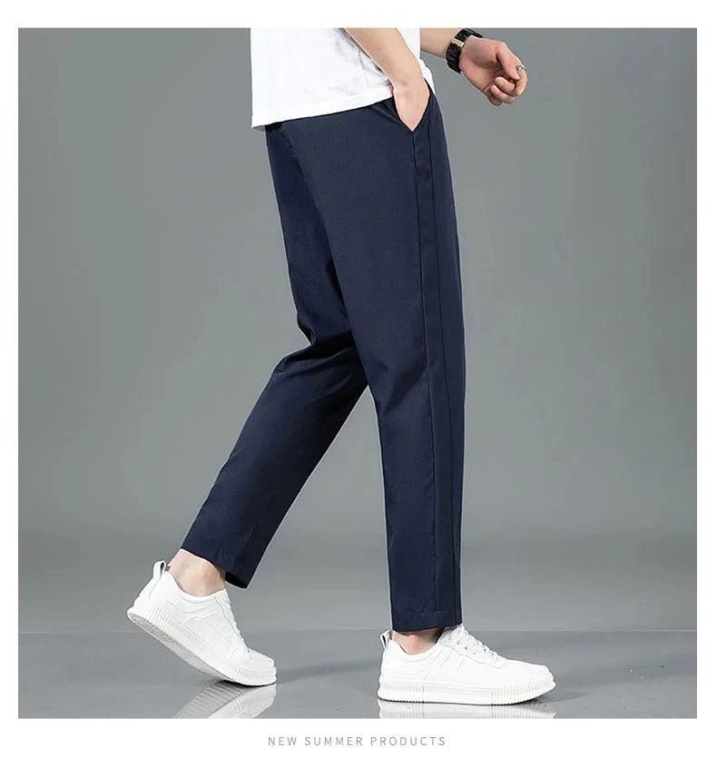 Mandotos Ice Silk men's summer casual pants in black and gray, slim fit, breathable, elastic straight-leg sweatpants for outdoor wear.