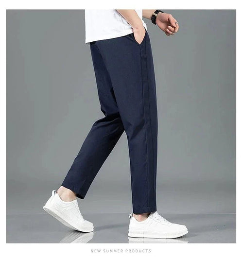 Mandotos Ice Silk men's summer casual pants in black and gray, slim fit, breathable, elastic straight-leg sweatpants for outdoor wear.