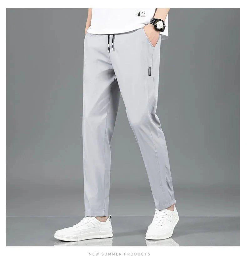 Mandotos Ice Silk men's summer casual pants in black and gray, featuring a breathable, elastic, straight-leg design.