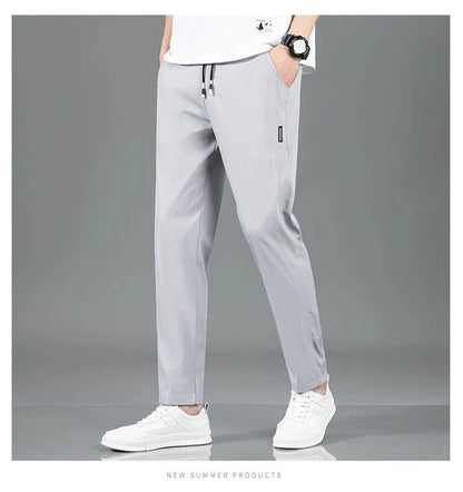 Mandotos Ice Silk men's summer casual pants in black and gray, featuring a breathable, elastic, straight-leg design.