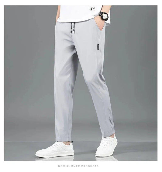 Mandotos Ice Silk men's summer casual pants in black and gray, featuring a breathable, elastic, straight-leg design.