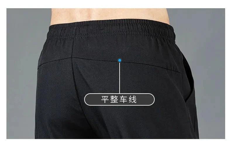 Mandotos Ice Silk men's summer pants in black and gray featuring a slim, straight-leg design, breathable and elastic for outdoor casual wear.