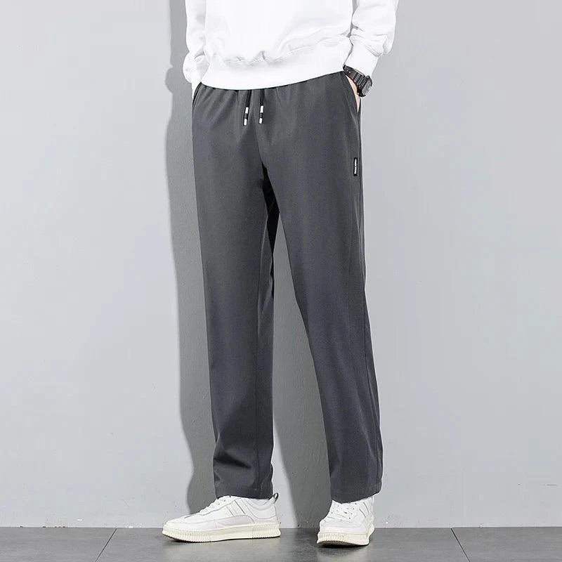 Mandotos Ice Silk men's summer casual pants in black and gray, breathable, elastic, straight-leg sweatpants for outdoor and business wear.