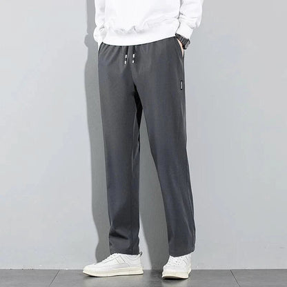 Mandotos Ice Silk men's summer casual pants in black and gray, breathable, elastic, straight-leg sweatpants for outdoor and business wear.