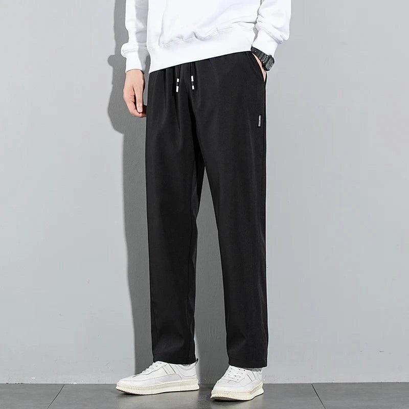 Mandotos Ice Silk men's summer pants in black and gray, breathable, elastic, straight-leg casual and outdoor sweatpants.