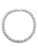 Mandotos Illumina tennis chain with clustered stones and radiant embellishments, showcasing elegant jewelry design and sparkling details.