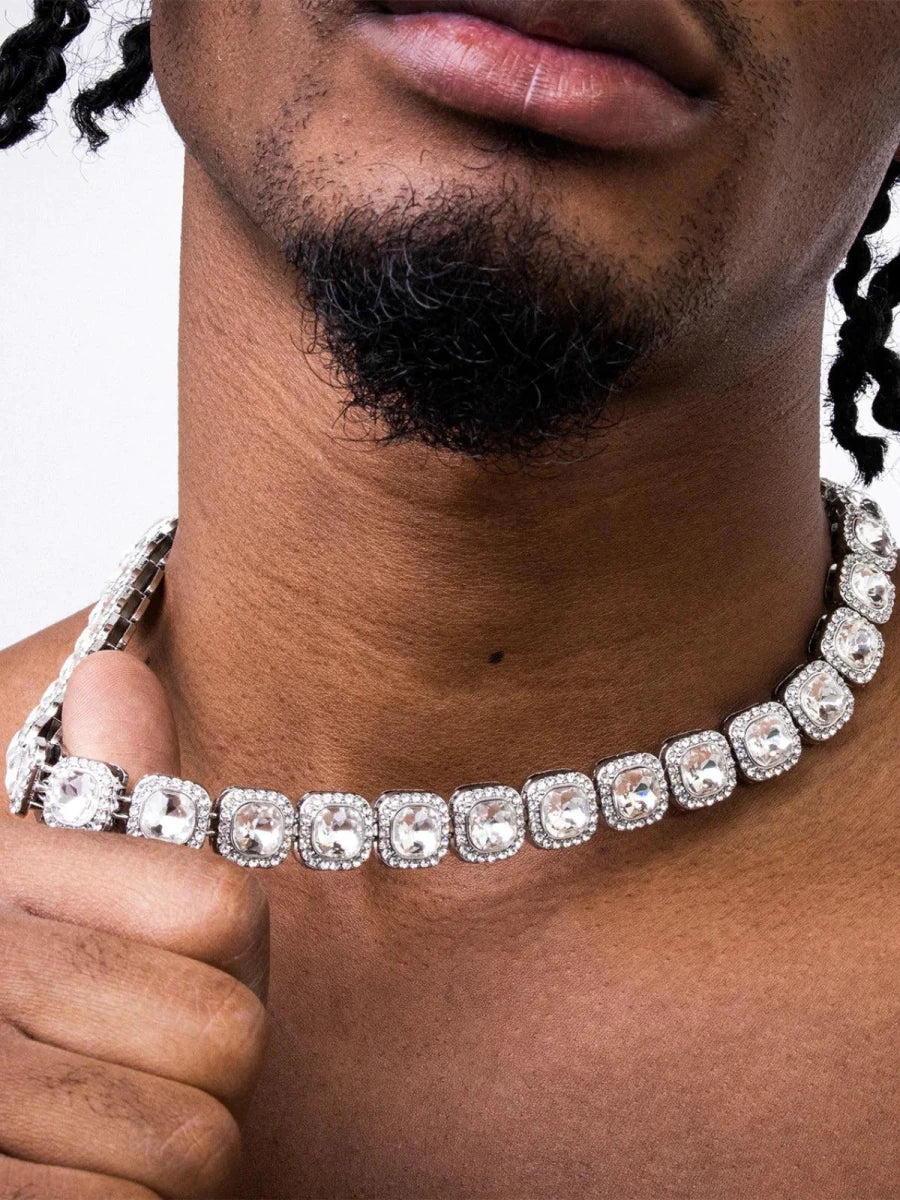 Mandotos Illumina Tennis Chain with clustered stones and radiant embellishments, showcasing elegant, sparkling jewelry design.