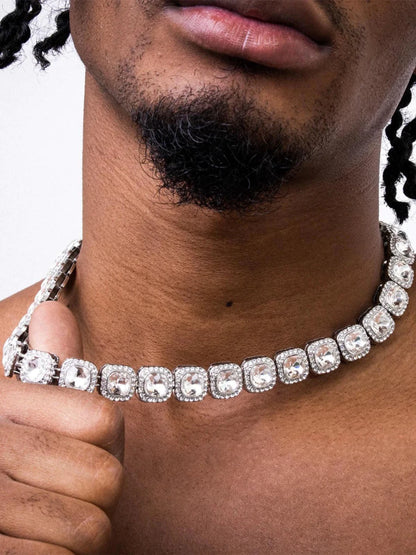 Mandotos Illumina Tennis Chain with clustered stones and radiant embellishments, showcasing elegant, sparkling jewelry design.