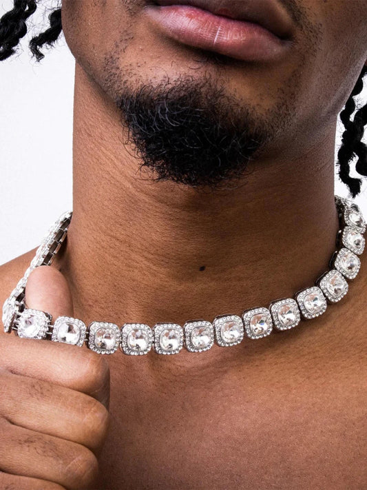 Mandotos Illumina Tennis Chain with clustered stones and radiant embellishments, showcasing elegant, sparkling jewelry design.