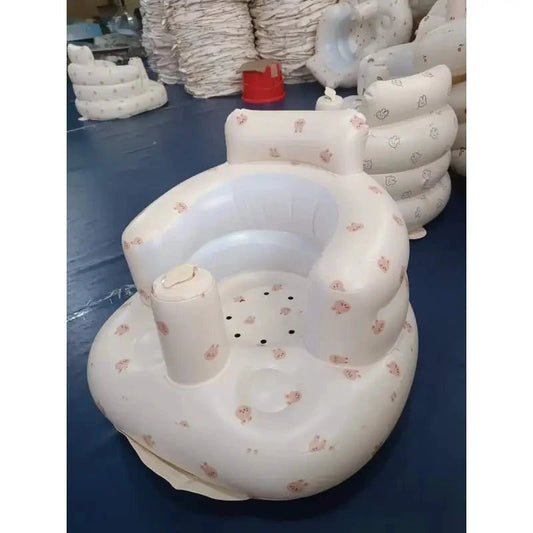 Inflatable baby chair by MANDOTOS designed for dining and bath, with soft, colorful inflatable cushions for comfortable seating.