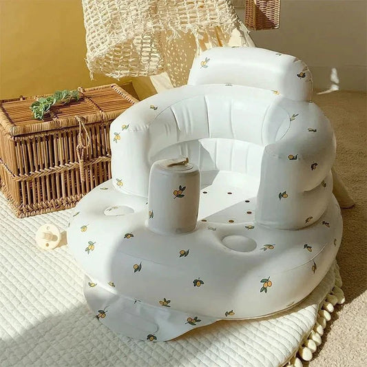 Inflatable baby chair from MANDOTOS for dining and bath, featuring soft material and secure design for infant comfort and safety.