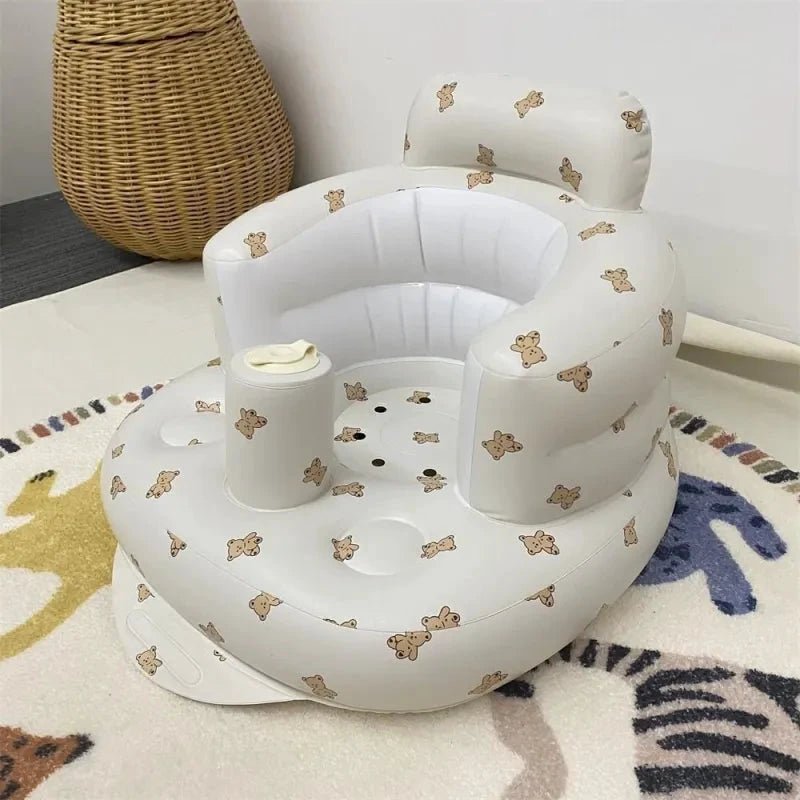 Inflatable baby chair for dining and bath by MANDOTOS, featuring a soft, colorful design with a secure seat for infants.
