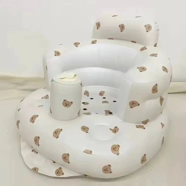 Inflatable baby chair by MANDOTOS designed for dining and bath, with soft, durable material and a secure, supportive seat for infants.