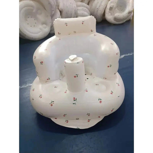 Inflatable baby chair by MANDOTOS designed for dining and bath, featuring a soft, durable surface and secure seating for infants.