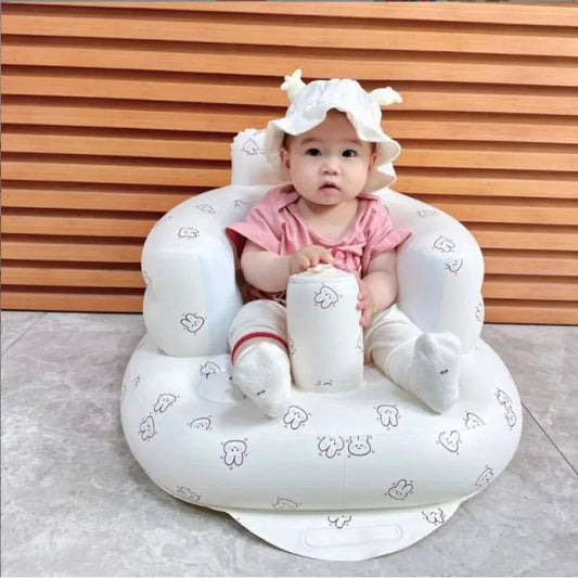 Inflatable baby chair for dining and bath by MANDOTOS, featuring a soft, inflatable design for comfortable seating.