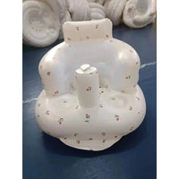 Inflatable baby chair from MANDOTOS designed for dining and bath, featuring a soft cushion and secure sides for comfort and safety.