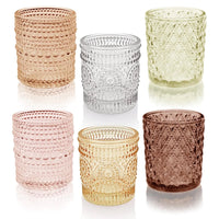Set of 12 multicolor glass tealight holders by MANDOTOS INTERNATIONAL, perfect for special occasions and decorative lighting.