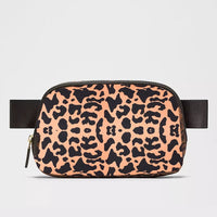 Mandotos International 1L breathable women’s fanny pack, ideal for travel and outdoor use, shown in black with adjustable strap.