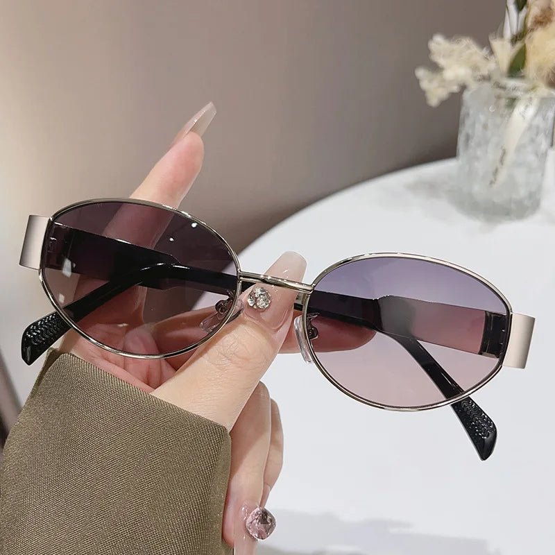 Women's geometric PC sunglasses with elliptical metal frames, large design, personalized style, by MANDOTOS INTERNATIONAL.
