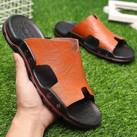 Retro leather men's summer beach slippers by MANDOTOS INTERNATIONAL with flat design and casual style for warm weather.
