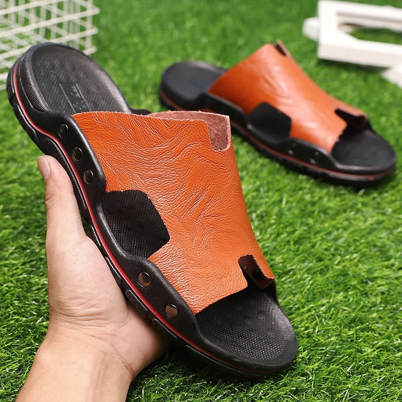 Retro leather men's summer beach slippers by MANDOTOS INTERNATIONAL with flat design and casual style for warm weather.