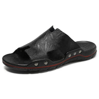 Retro leather men's summer beach slippers by MANDOTOS INTERNATIONAL featuring flat sandal design and casual open-toe style.