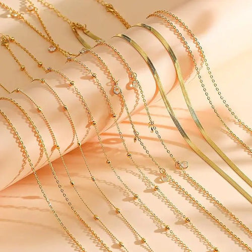 Eight-piece gold-plated waist chain set featuring beaded, sequin, CZ coin designs, adjustable body jewelry from MANDOTOS INTERNATIONAL.