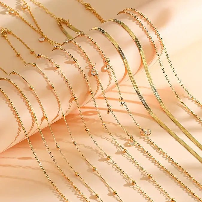 Eight-piece gold-plated waist chain set featuring beaded, sequin, CZ coin designs, adjustable body jewelry from MANDOTOS INTERNATIONAL.