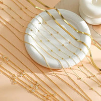 8-piece gold-plated waist chain set with beaded, sequin, CZ coin design, adjustable belly belt jewelry by MANDOTOS INTERNATIONAL.