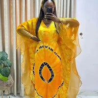 African Dashiki Ankara maxi dress for women, traditional long dress with vibrant patterns by MANDOTOS INTERNATIONAL.