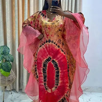 African Dashiki Ankara Maxi Dress for women by MANDOTOS INTERNATIONAL, featuring vibrant traditional print and flowing long design.