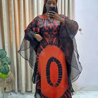 African Dashiki Ankara maxi dress for women, traditional long dress with vibrant patterns by MANDOTOS INTERNATIONAL.