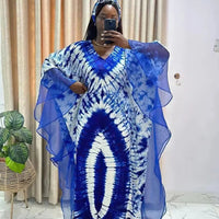 African Dashiki Ankara Maxi Long Dress for women, traditional clothing by MANDOTOS INTERNATIONAL, featuring vibrant patterns and flowing fabric.
