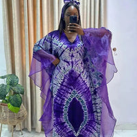 African Dashiki Ankara maxi long dress for women, traditional clothing by MANDOTOS INTERNATIONAL with vibrant patterns