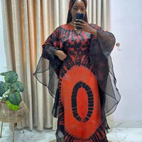 African Dashiki Ankara maxi dress for women by MANDOTOS INTERNATIONAL, featuring vibrant traditional fabric and long flowing design.