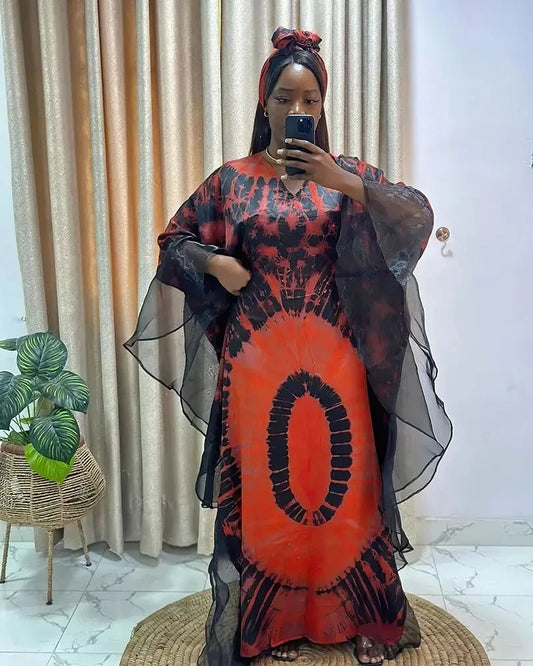 African Dashiki Ankara maxi dress for women by MANDOTOS INTERNATIONAL, featuring vibrant traditional fabric and long flowing design.