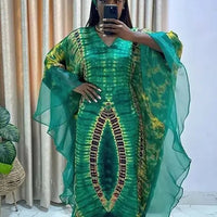 African Dashiki Ankara maxi long dress for women, traditional clothing with vibrant patterns by MANDOTOS INTERNATIONAL.
