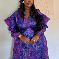 Traditional African dress for women featuring Ankara and dashiki styles, long maxi gown with vibrant patterns by MANDOTOS INTERNATIONAL.