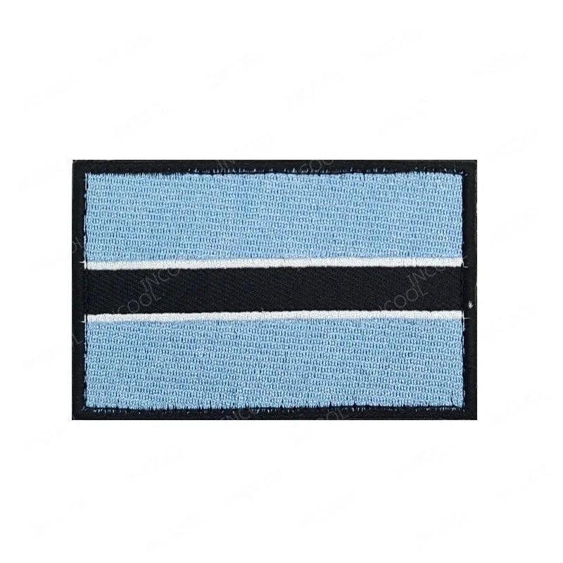 Embroidery patches featuring African flags and badges from Morocco, Nigeria, Gabon, Libya, and Namibia by MANDOTOS INTERNATIONAL.