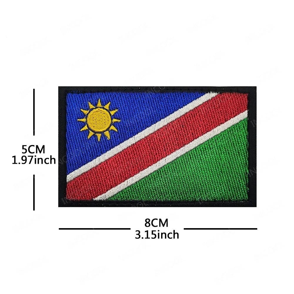 Embroidery patches of African flags and badges featuring Morocco, Nigeria, Gabon, Libya, and Namibia by MANDOTOS INTERNATIONAL.