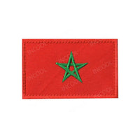 Embroidery patches of African flags and badges featuring Morocco, Nigeria, Gabon, Libya, and Namibia by MANDOTOS INTERNATIONAL.